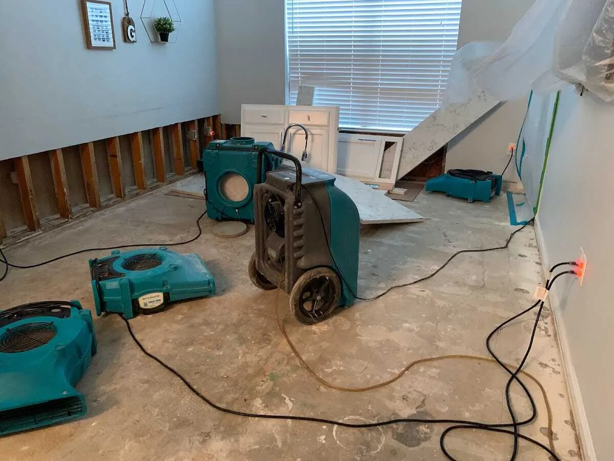 Dehumidifier in flood-cut room for Water Damage Restoration in Grinnell